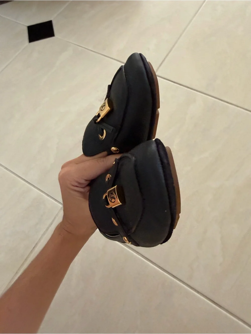 Louis Vuitton Black Leather Loafers with Gold Accent Hardware